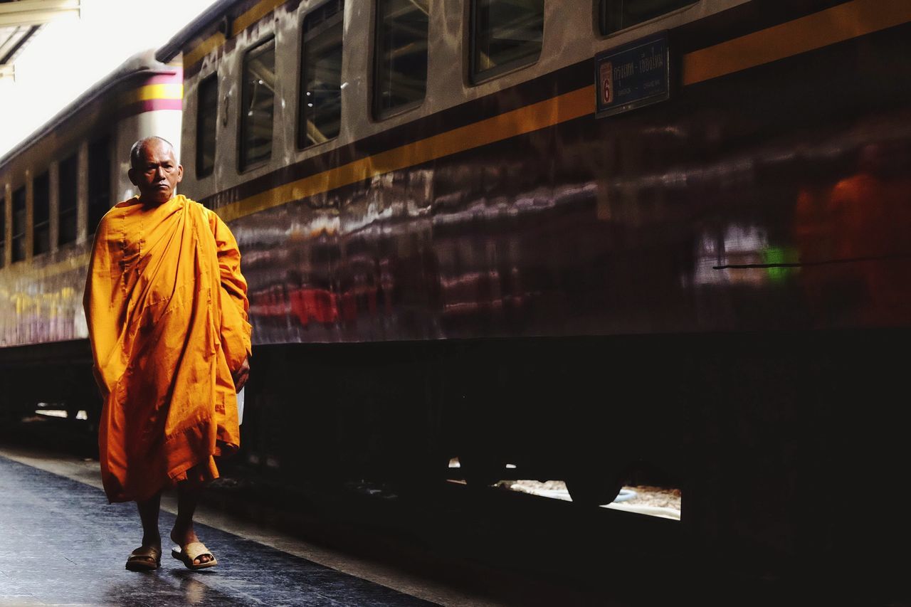 full length, real people, one person, standing, religion, traditional clothing, clothing, architecture, men, walking, built structure, belief, spirituality, lifestyles, front view, focus on foreground