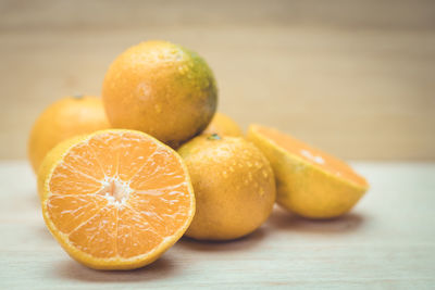 Close-up of oranges on table