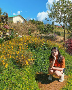 A girl asian squatting in the ground