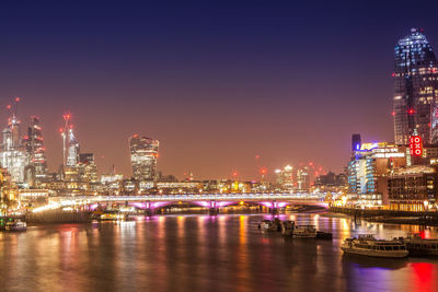 Illuminated buildings in city at night