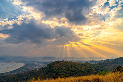 Scenic view of field against sky during sunset