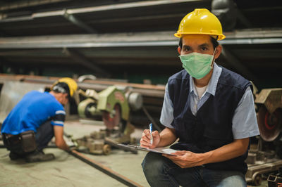 Portrait of man working in factory