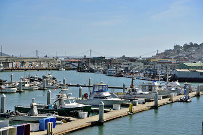 Boats moored at harbor