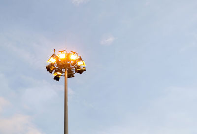 Low angle view of floodlight against sky