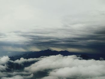 Scenic view of clouds covering mountains