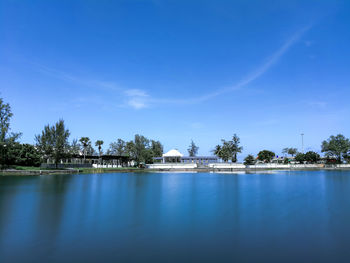 Scenic view of lake against blue sky