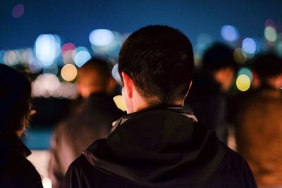 Woman standing at night