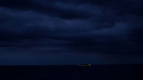 Scenic view of sea against sky at night