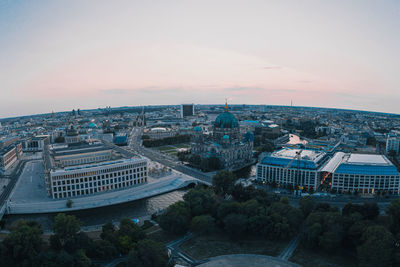 High angle view of buildings in city against sky at night