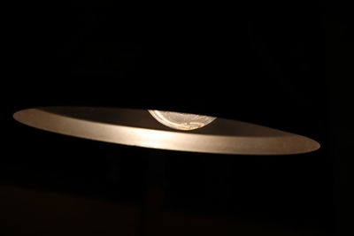 Close-up of electric lamp on table