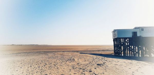 Scenic view of beach against clear sky