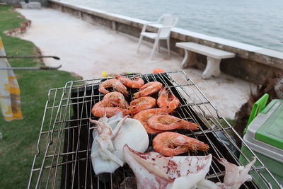 High angle view of fish on barbecue grill