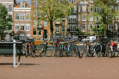 Bicycles on street against buildings in city