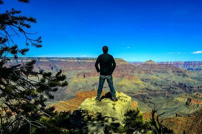 Silhouette of woman standing on landscape