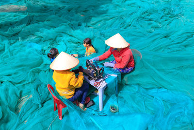 High angle view of two people in water