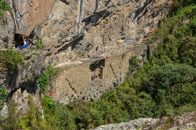 High angle view of people taking selfie on rock formation