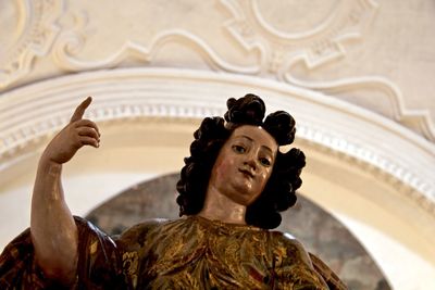 Low angle view of female statue