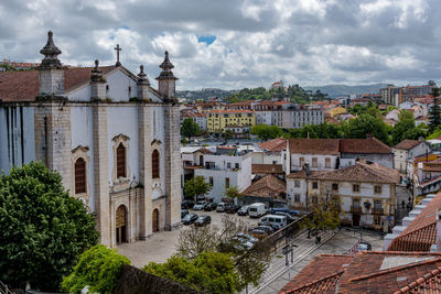 Buildings in town against sky