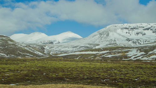 Scenic view of snowcapped mountains against sky