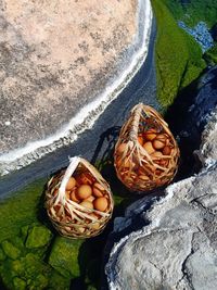 High angle view of bread on rock at beach