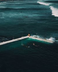 High angle view of infinity pool by sea