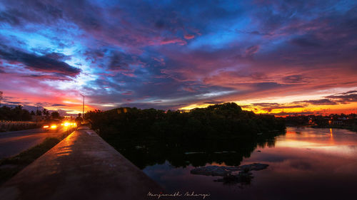 Scenic view of lake against sky during sunset
