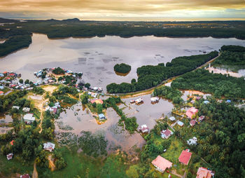 High angle view of lake against sky in city