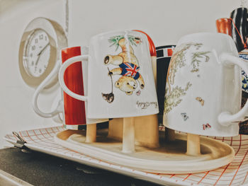 Close-up of cups in tray on table