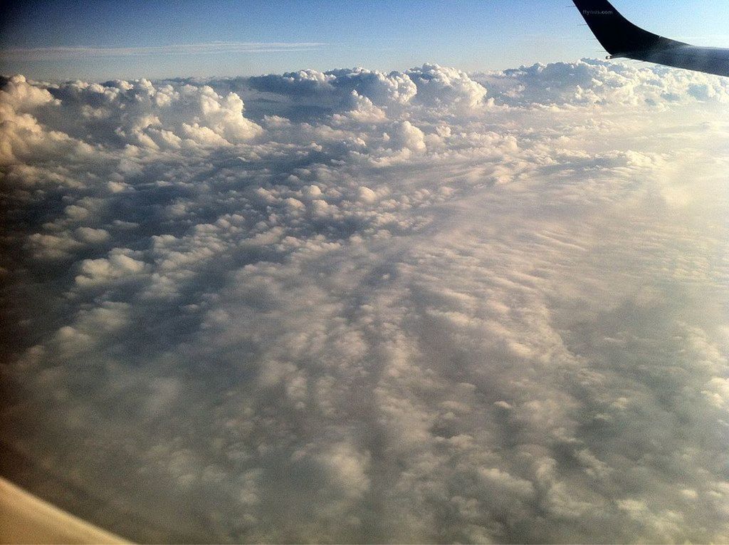 AERIAL VIEW OF CLOUDSCAPE OVER MOUNTAIN