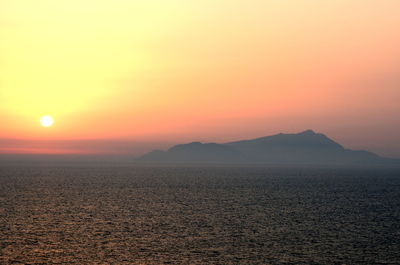 Scenic view of silhouette mountain against sky during sunset