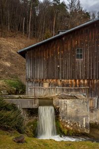 Scenic view of waterfall against sky