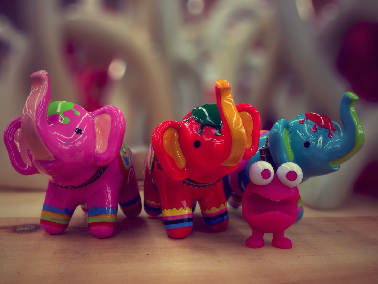 indoors, close-up, focus on foreground, multi colored, toy, still life, art and craft, creativity, selective focus, art, red, human representation, decoration, table, animal representation, celebration, variation, childhood, colorful, pink color