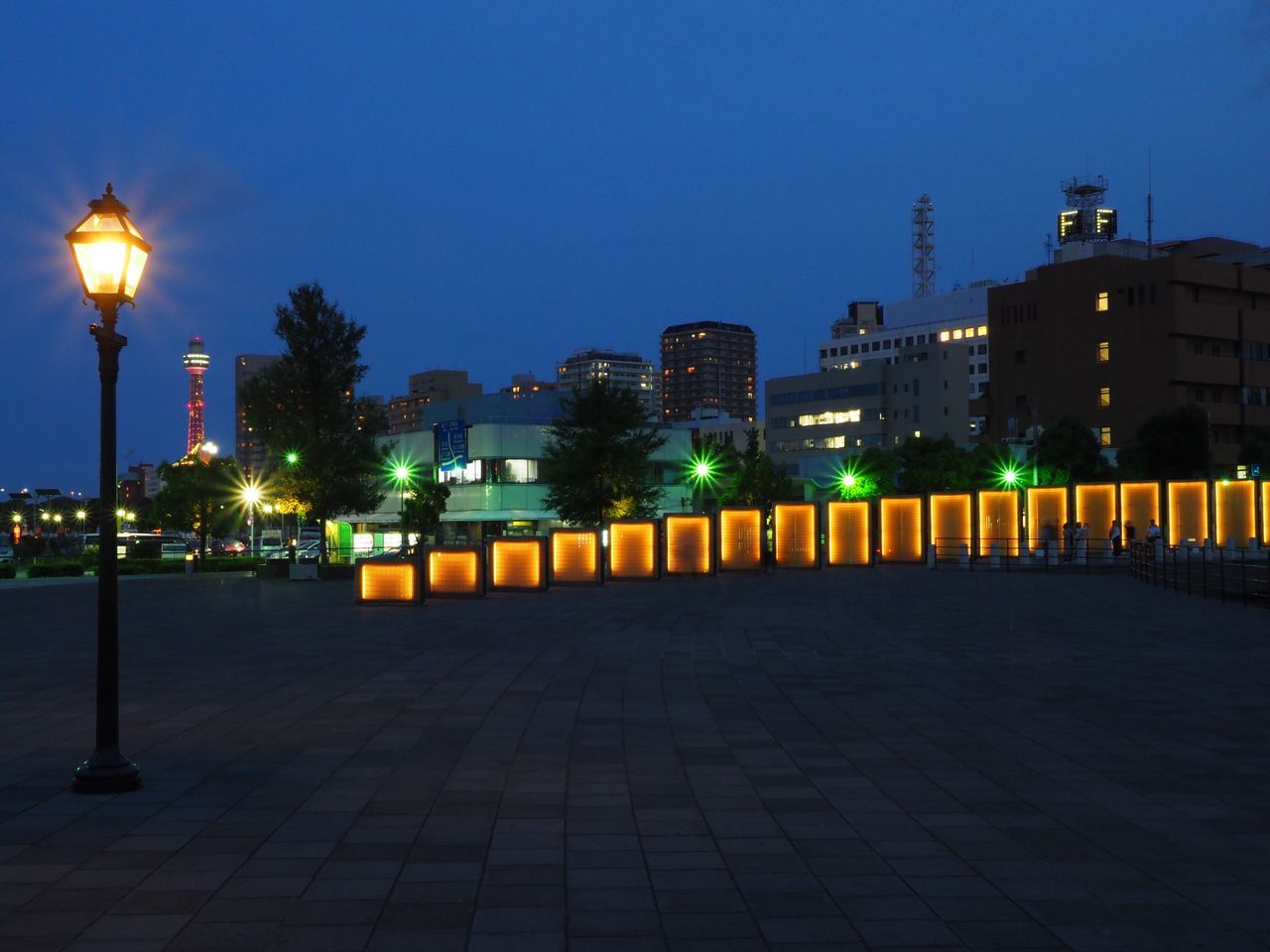 illuminated, night, building exterior, architecture, street light, lighting equipment, built structure, clear sky, city, outdoors, no people, sky, cityscape