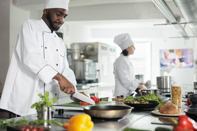 Chef preparing food in restaurant kitchen