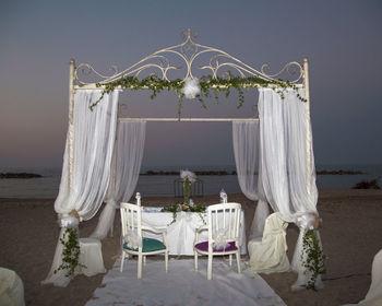Chairs and table with entertainment tent at beach