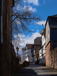 Street amidst buildings against sky