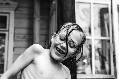 Portrait of smiling kid in the rain 