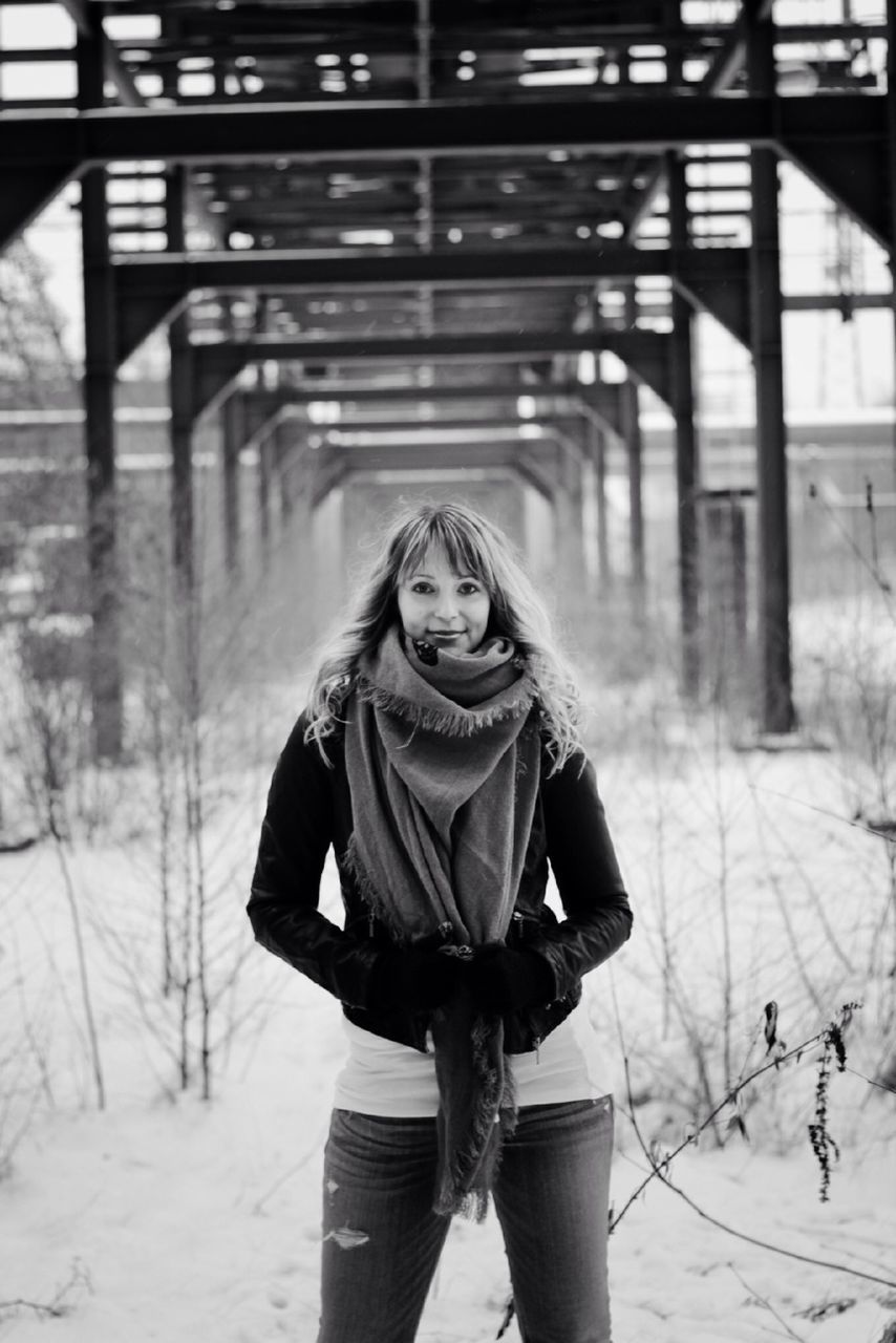 lifestyles, winter, casual clothing, standing, warm clothing, leisure activity, young adult, cold temperature, snow, person, front view, looking at camera, season, portrait, jacket, full length, three quarter length, focus on foreground