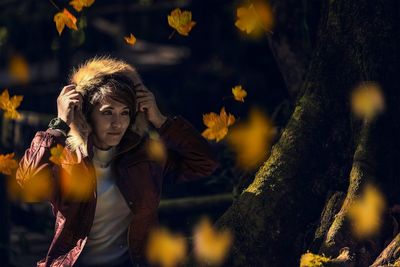 Woman wearing fur coat during autumn