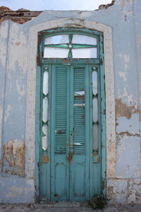 Closed door of old abandoned building