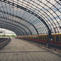 Train at railroad station against sky