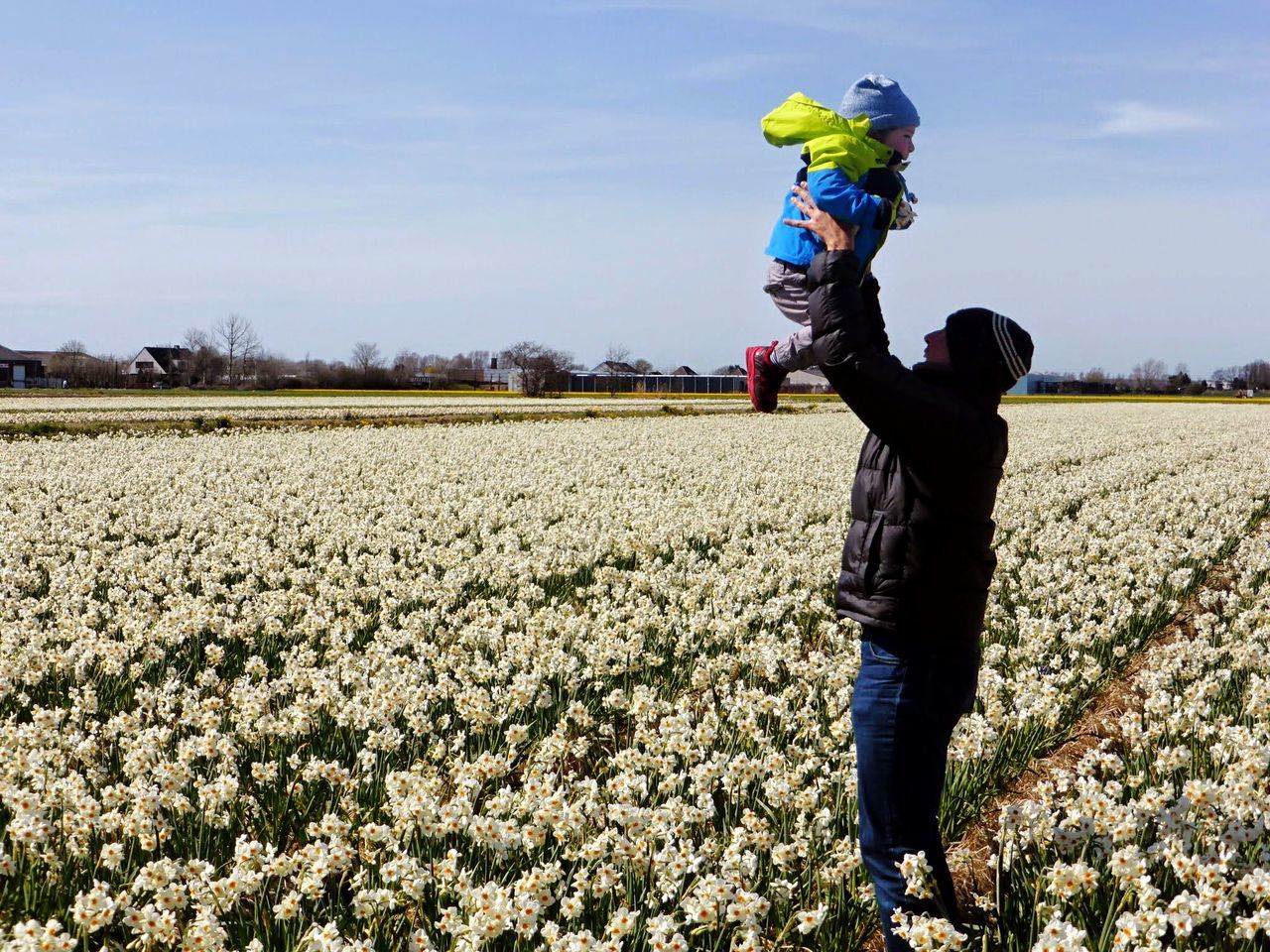 lifestyles, leisure activity, field, casual clothing, full length, childhood, person, sky, elementary age, standing, boys, agriculture, grass, landscape, girls, rural scene, front view, young adult