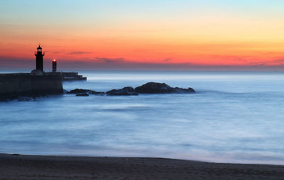 Scenic view of sea against sky during sunset