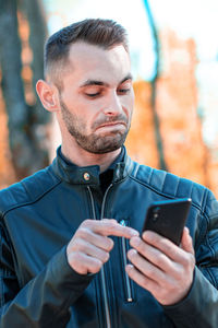 Young man using mobile phone