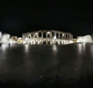 Illuminated fountain at night