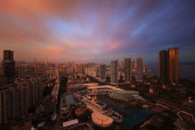 High angle view of buildings in city against sky