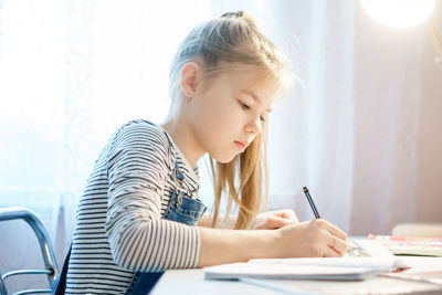 Girl studying at home