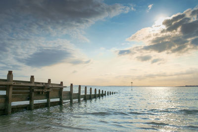 Pier over sea against sky