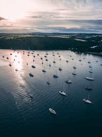 High angle view of birds in sea against sky