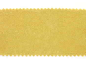 High angle view of yellow pattern on white background